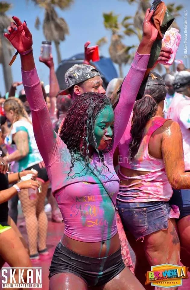 Jouvert guest dancing with colorful paint
